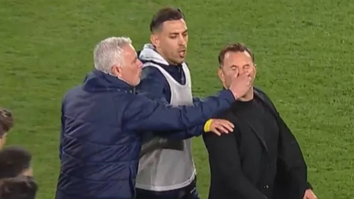 Jose Mourinho has to be restrained after putting his hands on Galatasaray manager as three players sent off in mass brawl