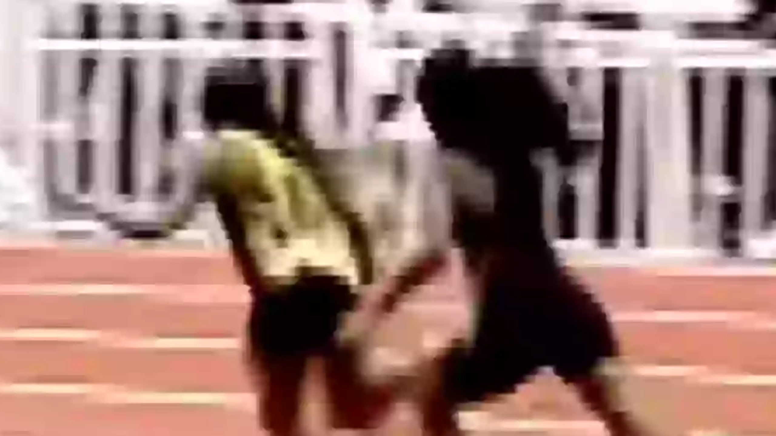 Runner who hit rival over head with baton shares new angle of incident as she faces assault charge