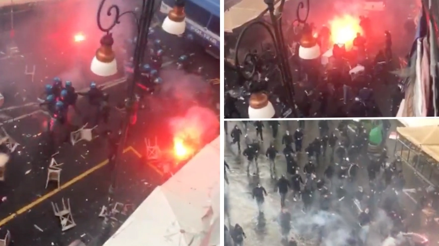 Streets of Naples on fire as football fans clash with police before Champions League match