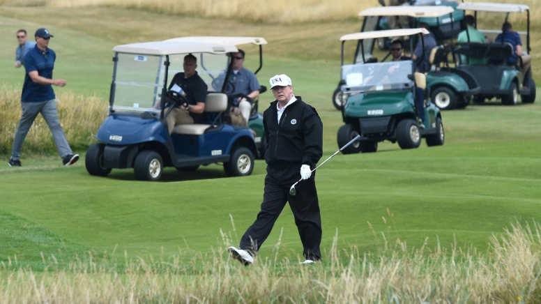 Donald Trump's caddy put man in military chokehold after hearing what he said about President during round of golf