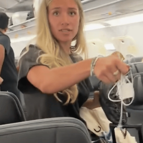 Bizarre moment woman sneakily 'steals' fellow passenger's Apple charger on flight leaves people divided