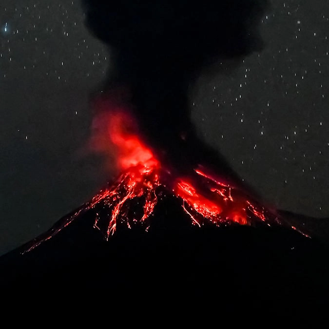 Thousands flee as Indonesian volcano spews ash 11 miles into the air