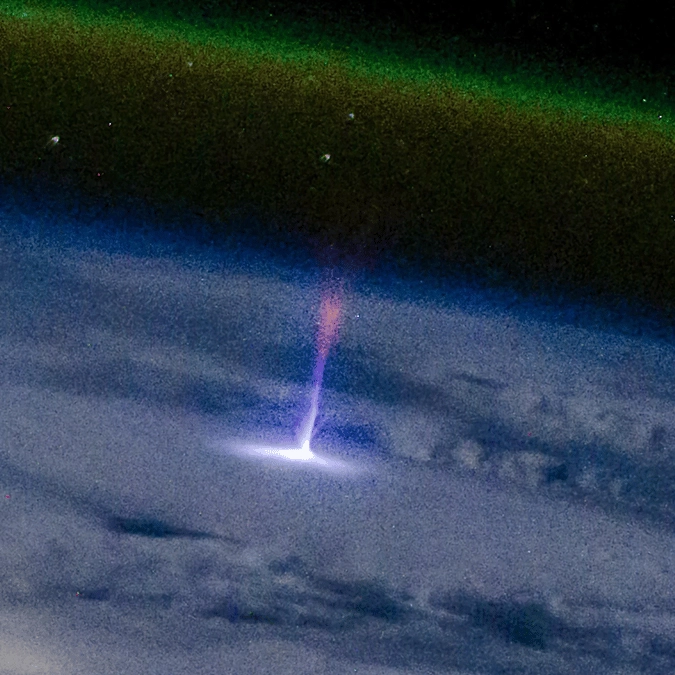 Astronaut on board ISS posts astonishing image of mysterious 'blue jet-sprite' stretching for miles across space