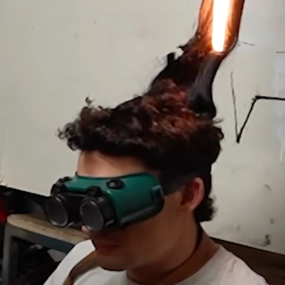 Man creates hair-cutting robot that uses lasers to slice hair in his 'most dangerous' video yet