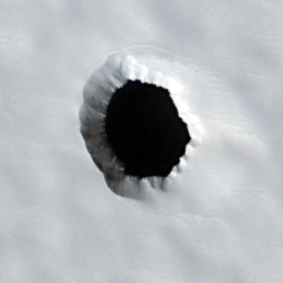 Secrets to extraterrestrial life could be hiding in mysterious holes on Mars surface