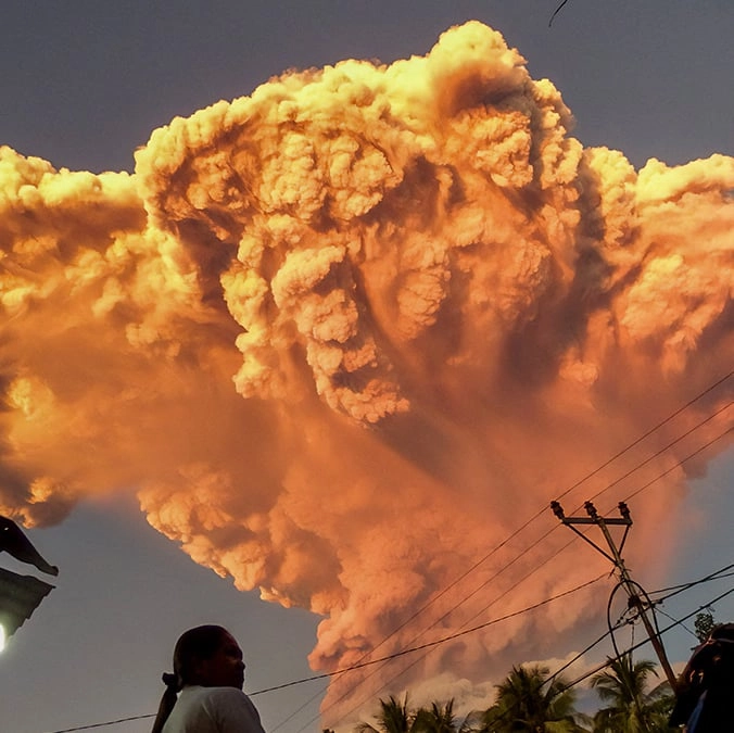 Highest alert issued as Indonesian volcano erupts 11,000 meters into the sky spitting ash for miles