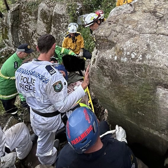 Terrifying images show woman trapped upside down under rock after attempting to retrieve dropped iPhone