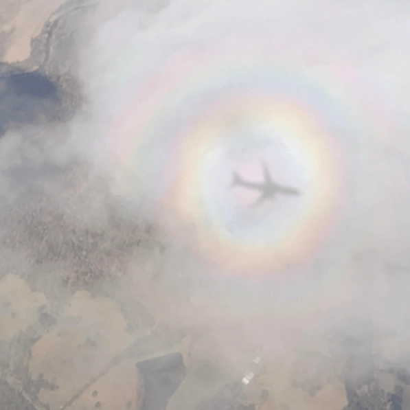 Woman takes ‘crazy’ photo of plane surrounded by rainbow in rare phenomenon known as 'pilot's glory'