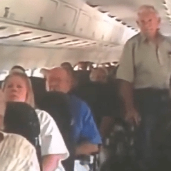 Unseen 9/11 footage captures shocked reactions of passengers on board a flight as they're told about the attacks