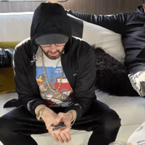 Fans can’t believe what phone Eminem still uses after rare photo captures him using it