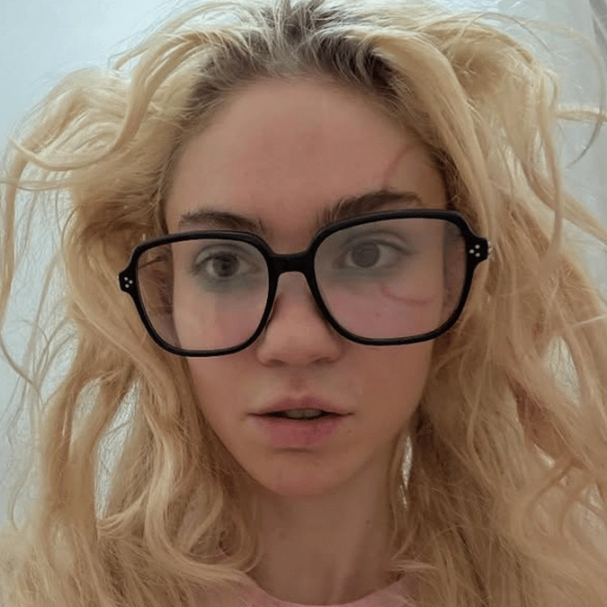 Elon Musk's ex Grimes reveals controversial face tattoo she spent 10 years 'emotionally' working up to