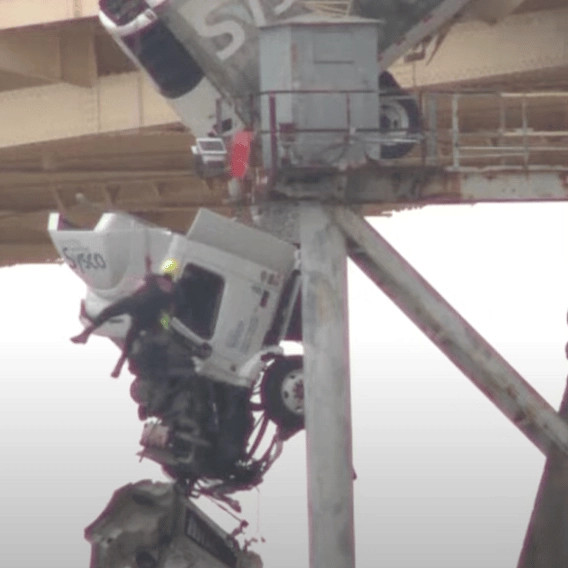 Terrifying dash cam footage shows moment driver loses control of truck and swerves off a bridge