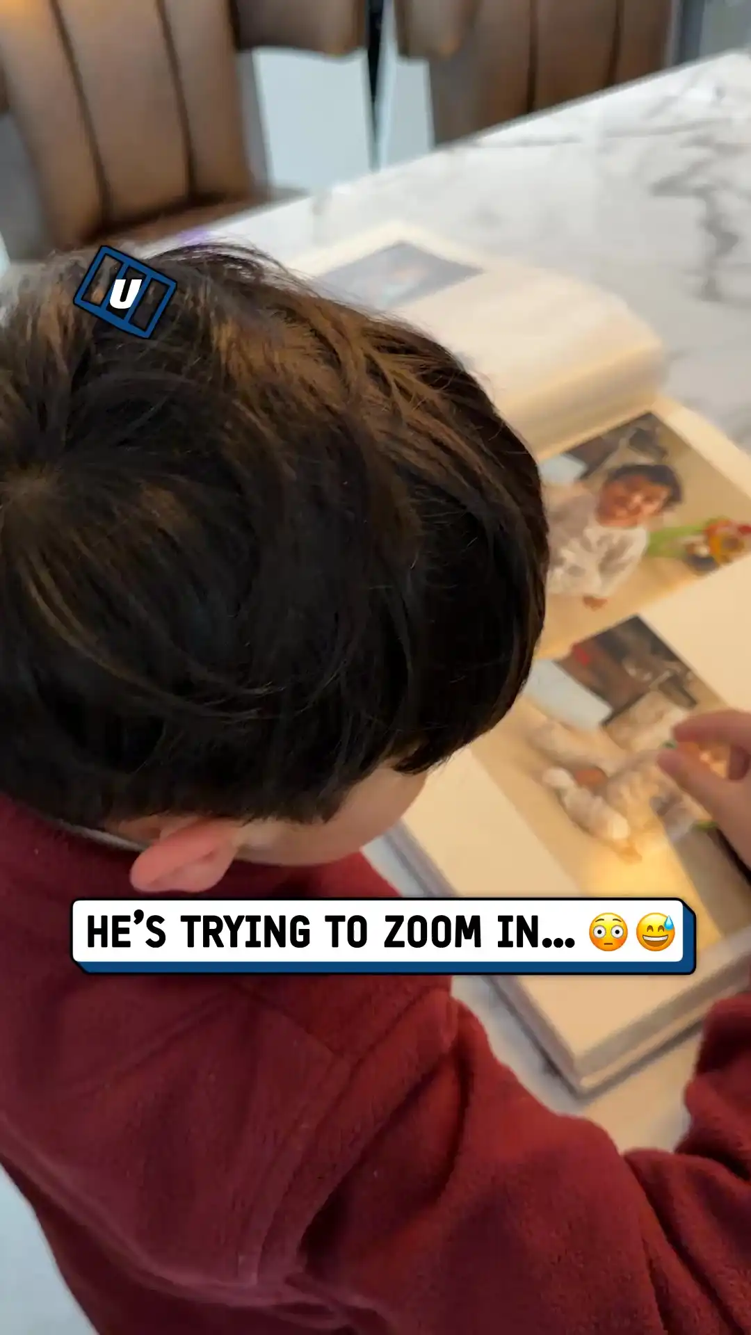 Kid tries zooming on photo album π€¦ββοΈπ€£