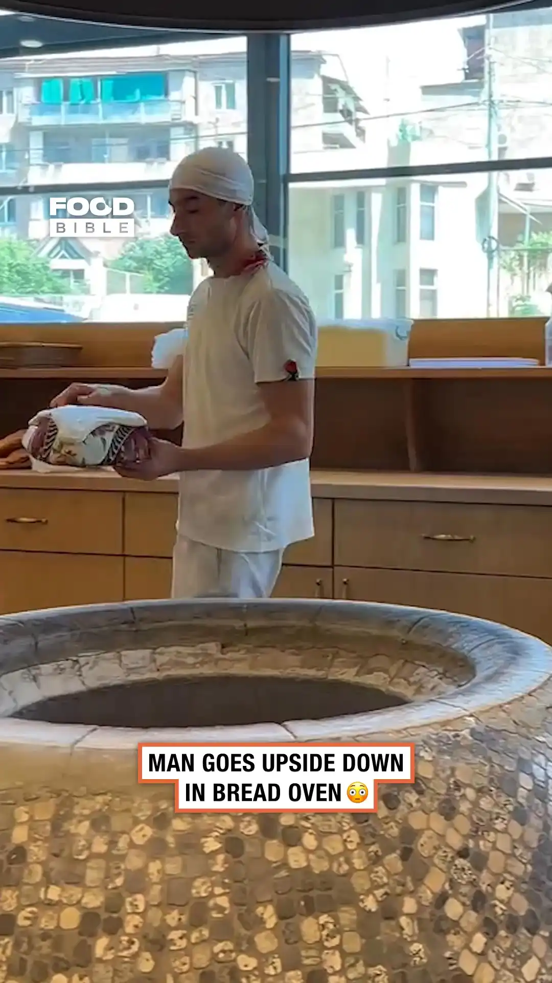 Man goes upside down in bread oven 🍞