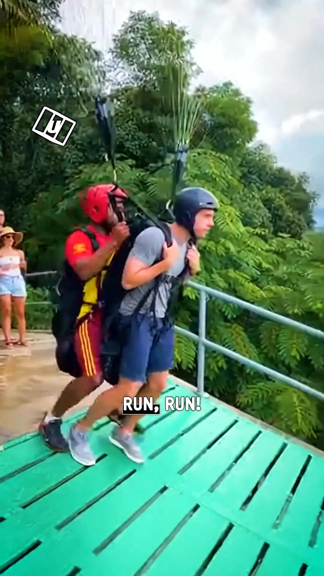 Guy takes a tumble when paragliding