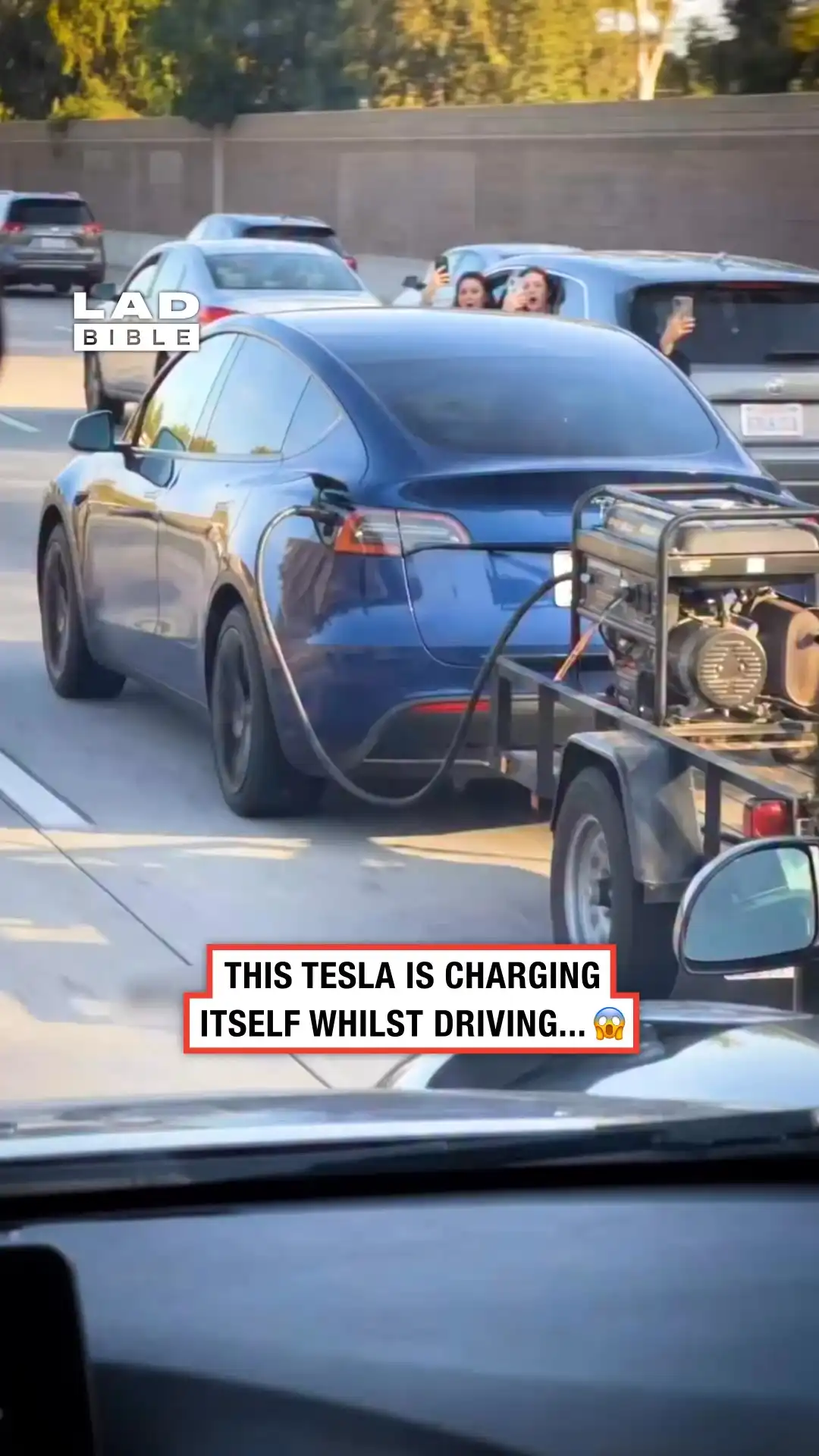 Electric car tows a generator behind it 😅