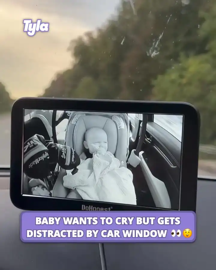 Baby wants to cry but gets distracted by car window 👀