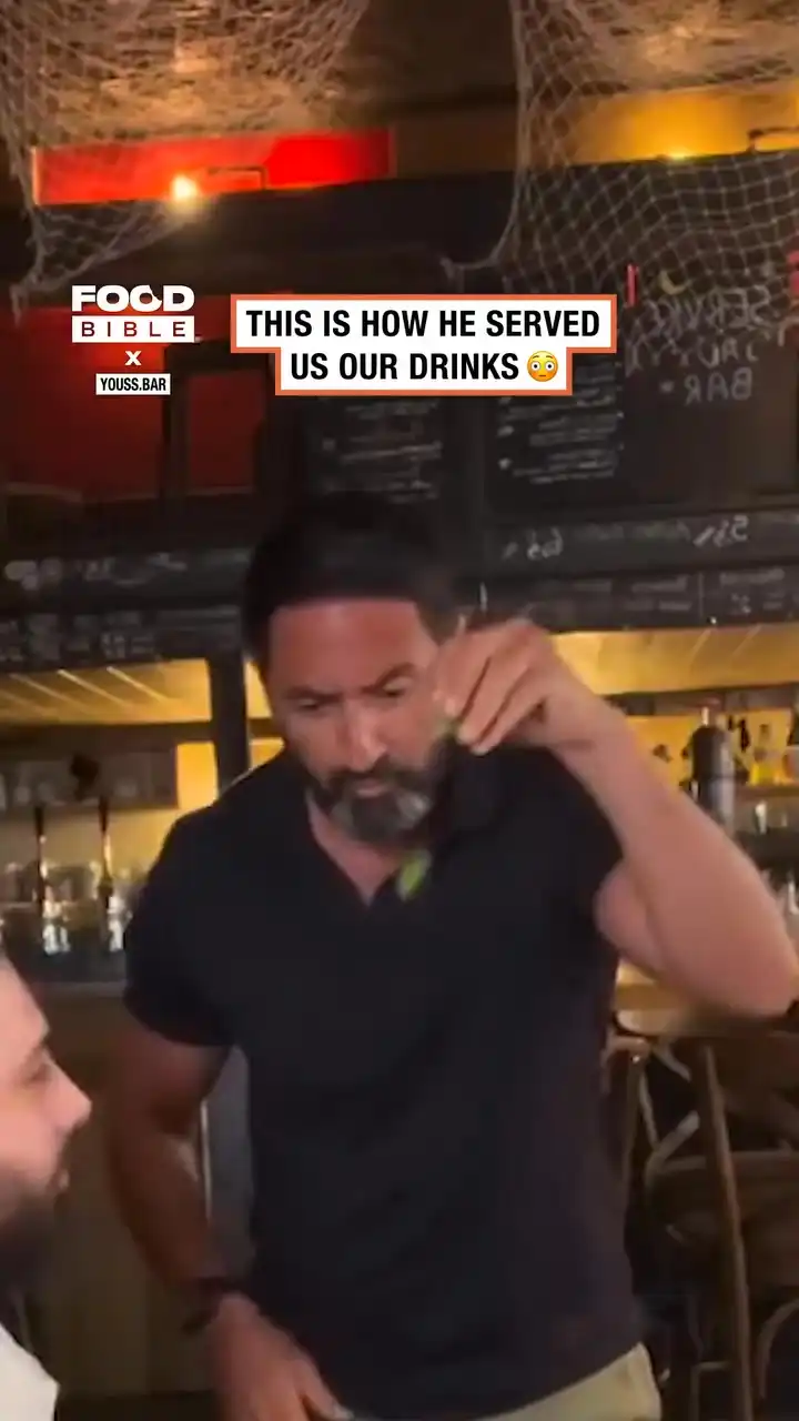 Waiter throws drinks on the table