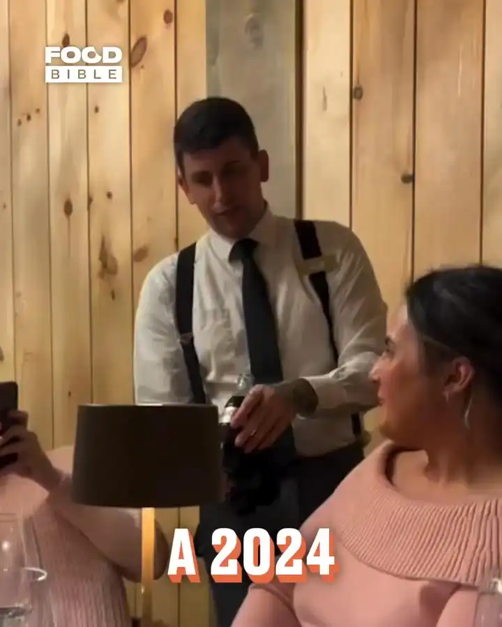 Waiter elegantly serving Diet Coke π