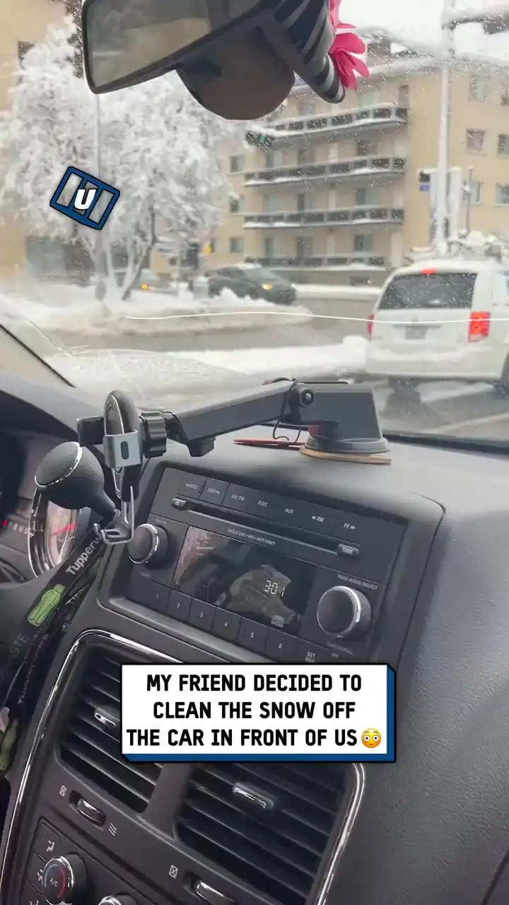 Clearing snow off a stranger's back window
