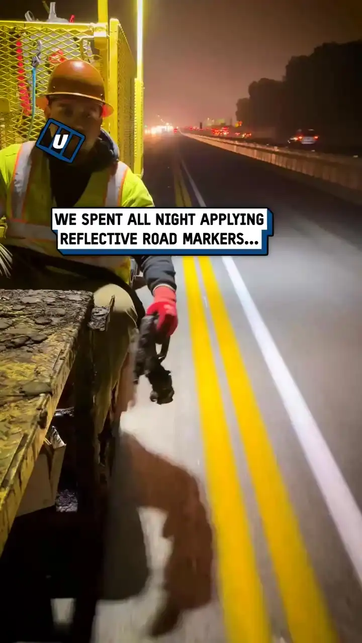 Workers apply reflective road markers 😲🔦