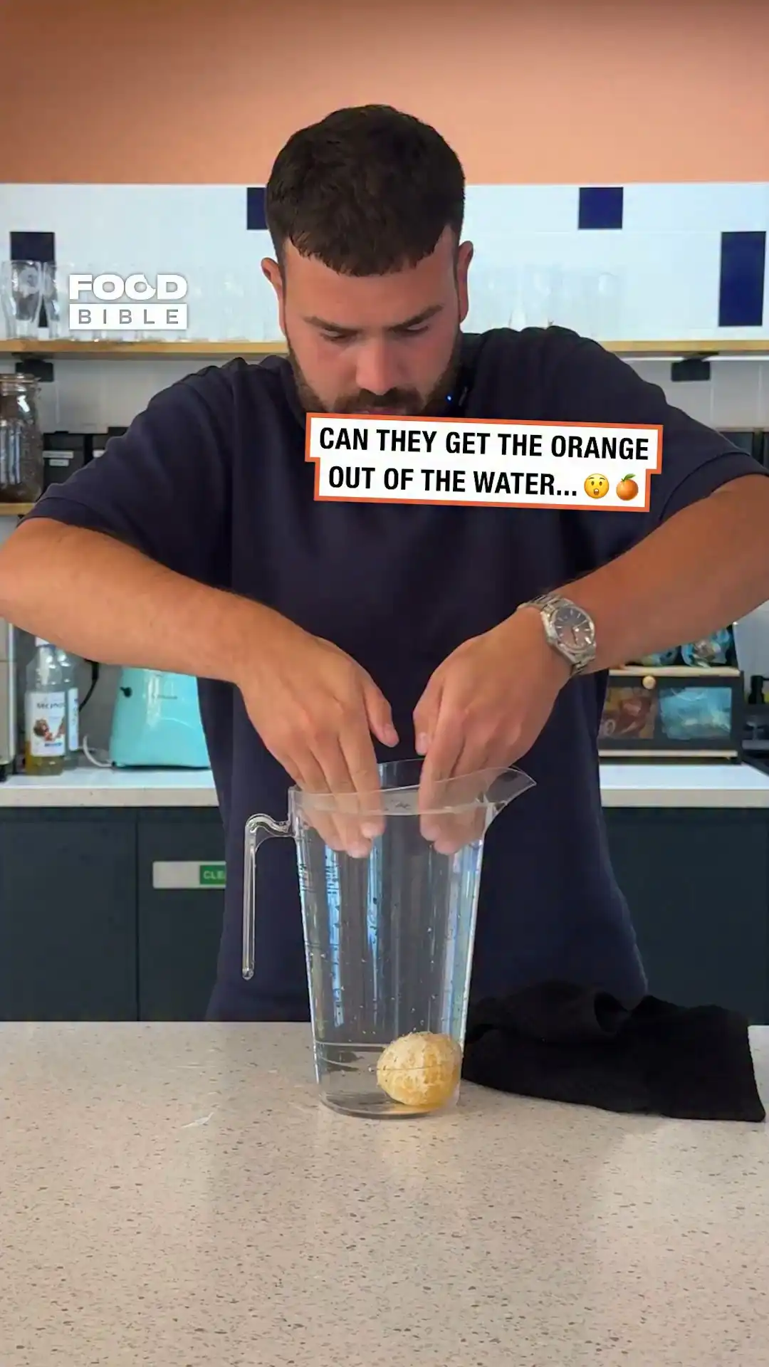 Get an orange out of a jug of water without spilling a drop