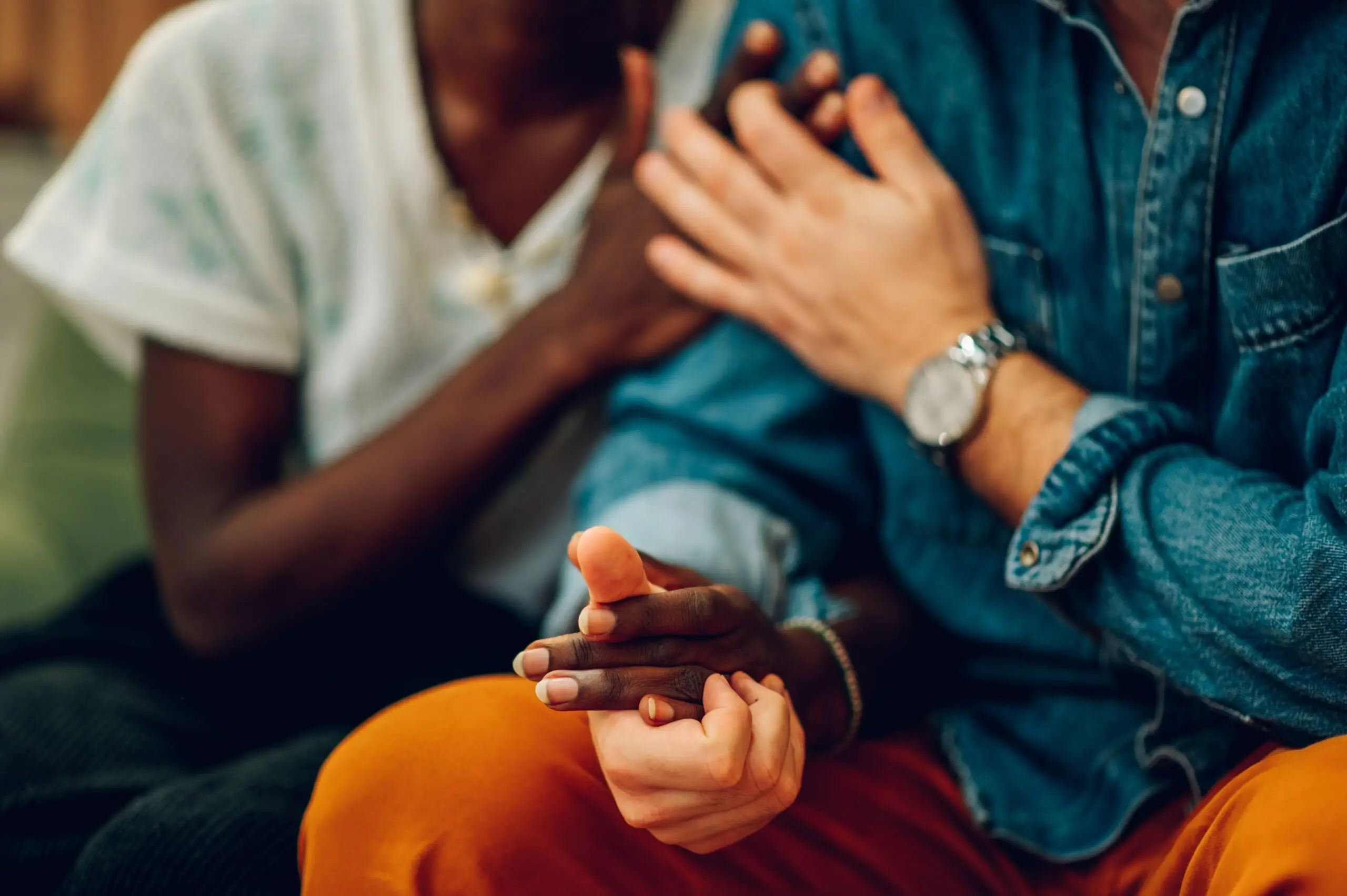 Young biracial couple holding hands.