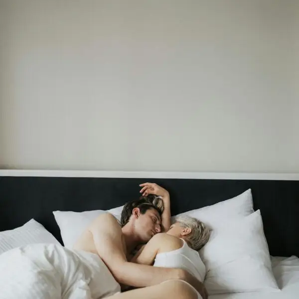 couple cuddling in bed