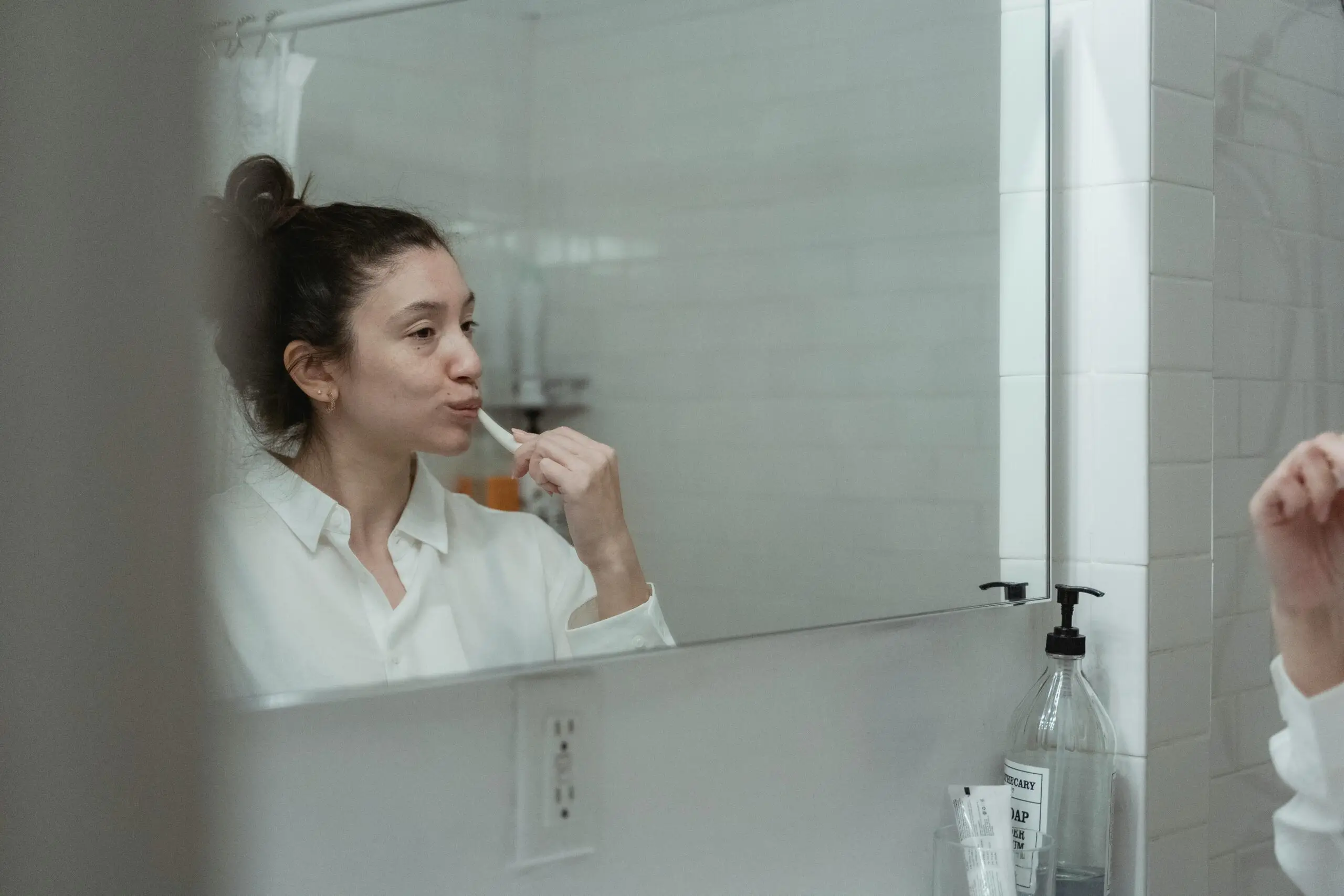 woman brushing teeth