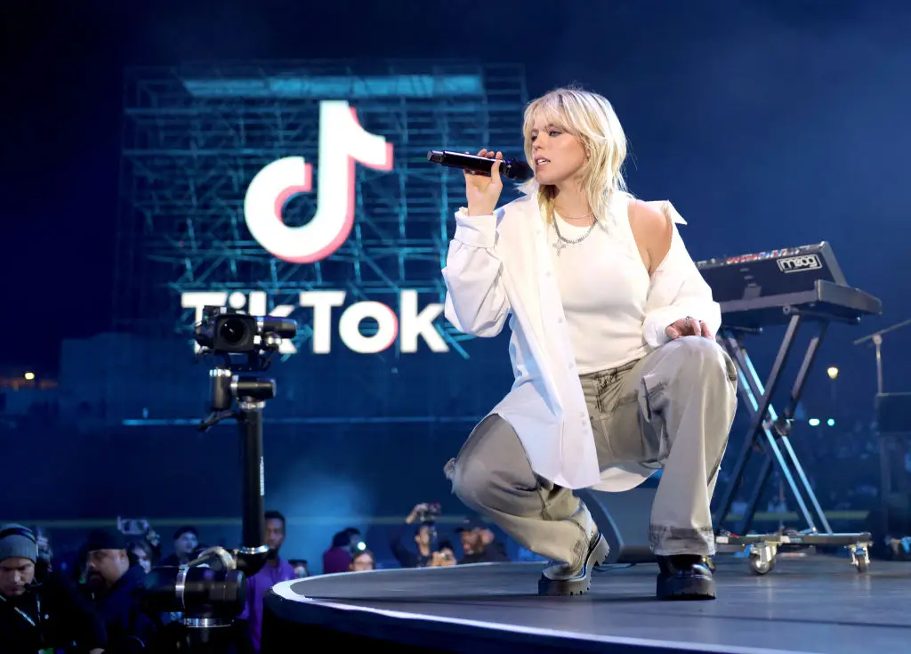 Renee Rapp performs at a TikTok show