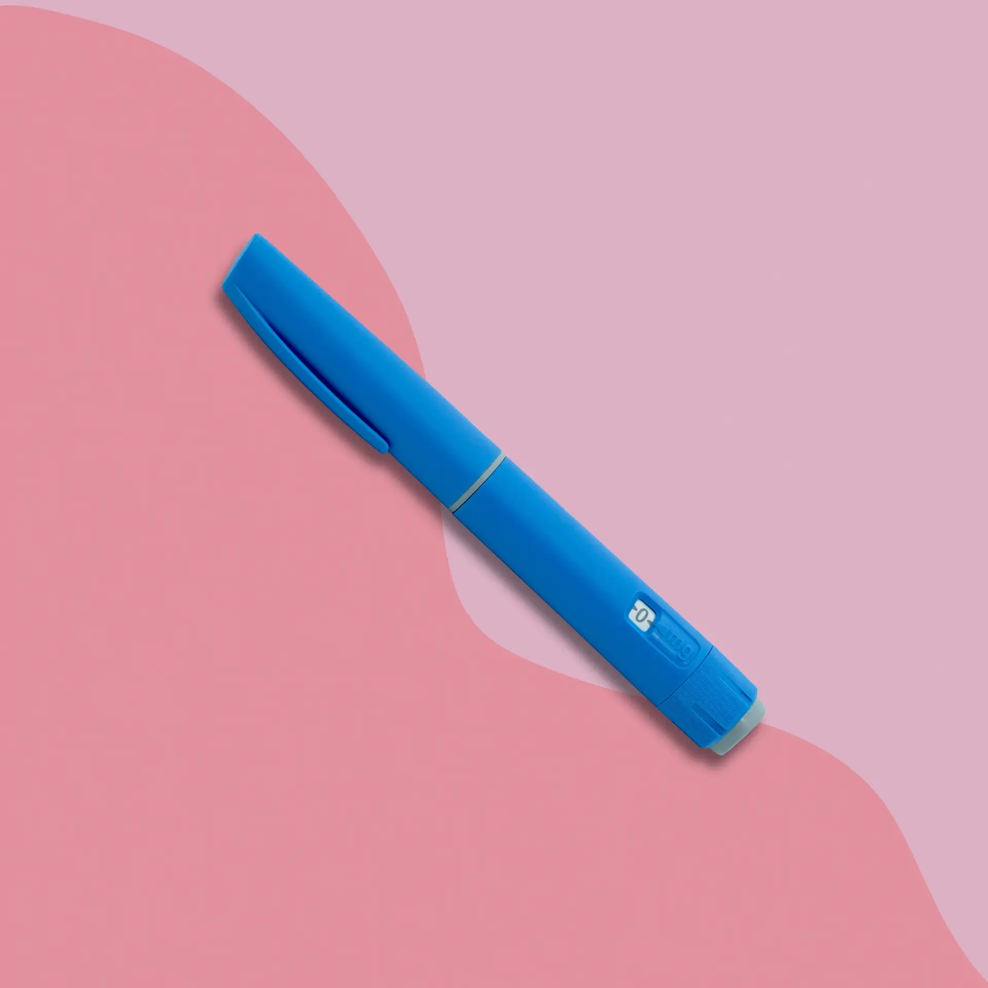 Blue semaglutide pen on colorful pink background