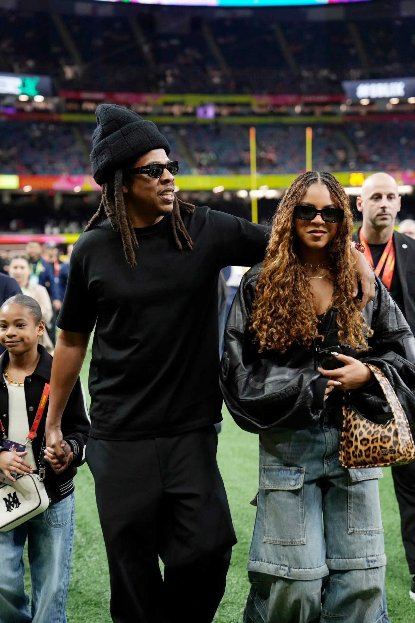 Jay-Z and his daughter Blue Ivy Carter, right, are seen on the sidelines before the NFL Super Bowl 59 football game between the Kansas City Chiefs and the Philadelphia Eagles, Sunday, Feb. 9, 2025, in New Orleans. (AP Photo/Doug Benc)