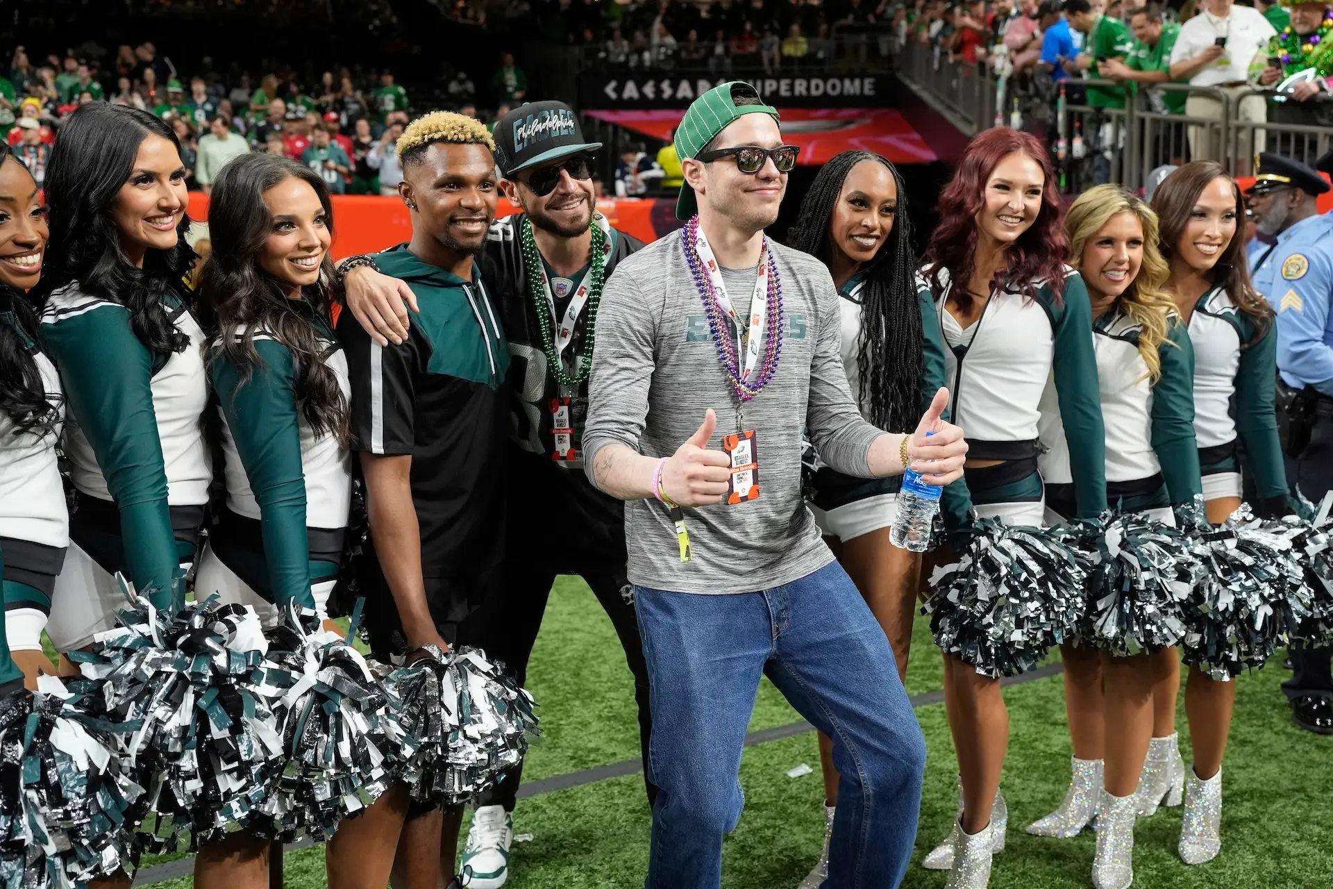 Pete Davidson poses for a photo with Philadelphia Eagles cheerleaders before the NFL Super Bowl 59 football game between the Kansas City Chiefs and the Philadelphia Eagles, Sunday, Feb. 9, 2025, in New Orleans. (AP Photo/George Walker IV)