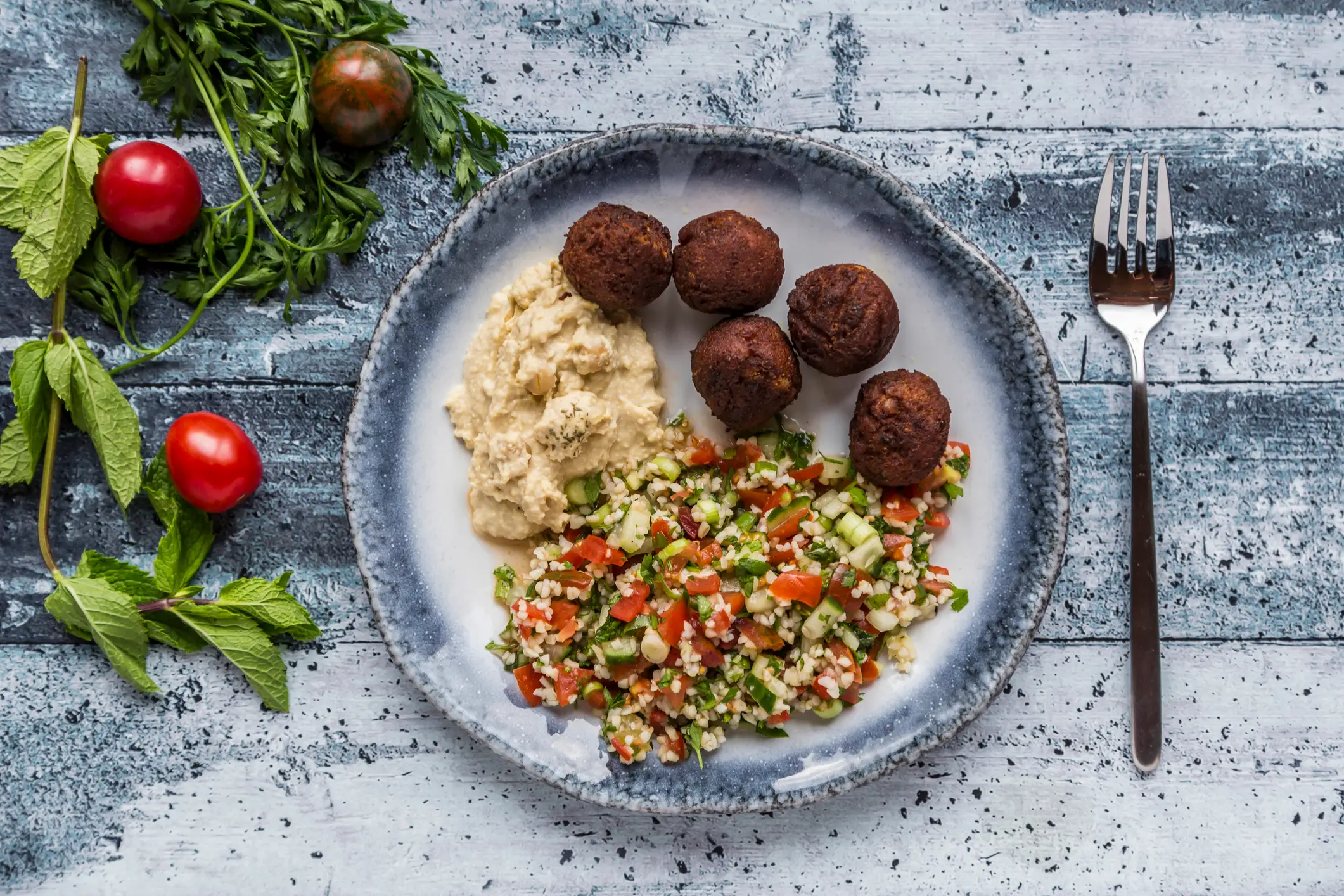 Lunches including plant based protein like falafel and hummus help keep you fuller for longer (Westend61/Getty)