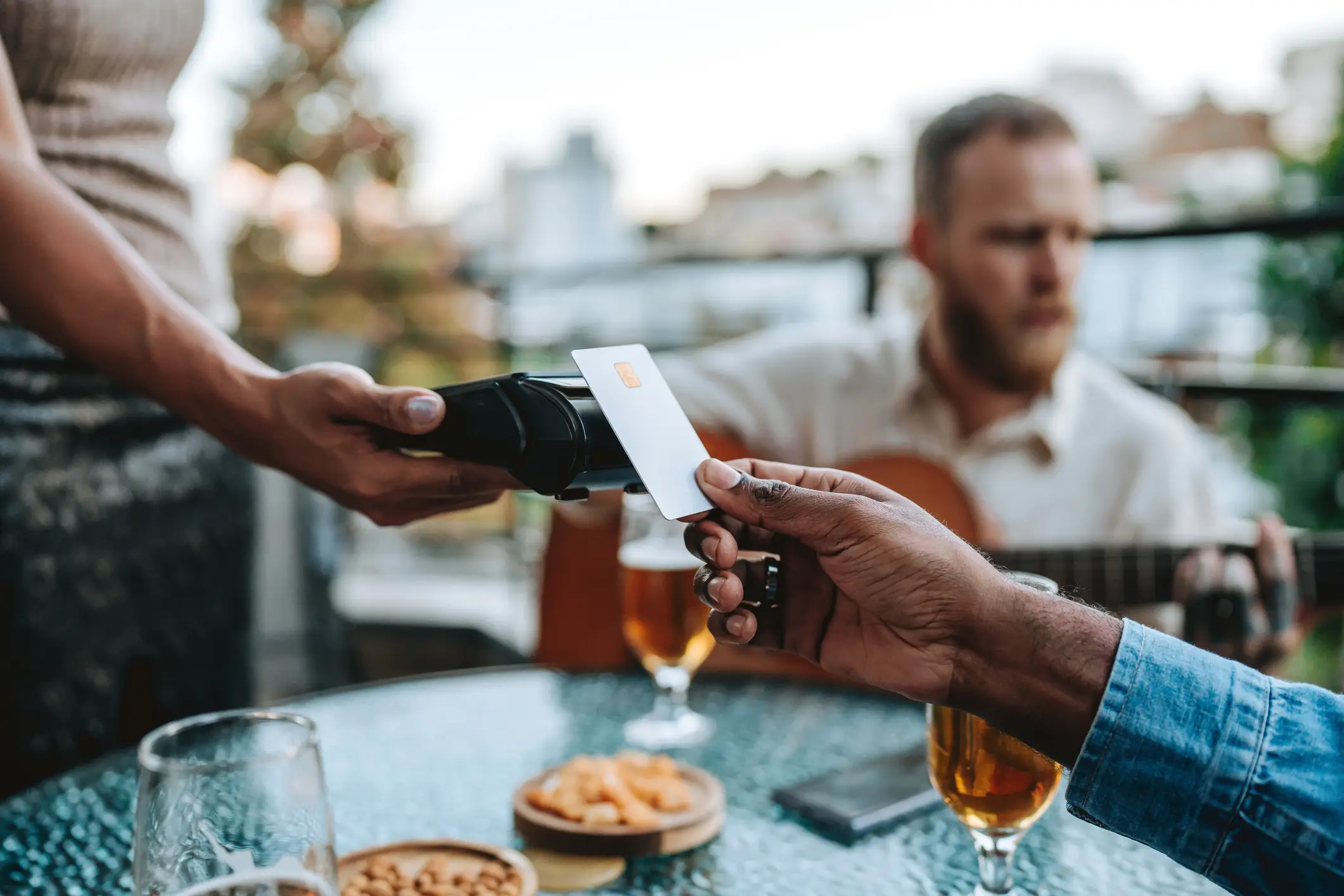 No, playing an acoustic guitar at the dinner table isn't the trick in question. Please don't do that (andreswd/Getty Images)