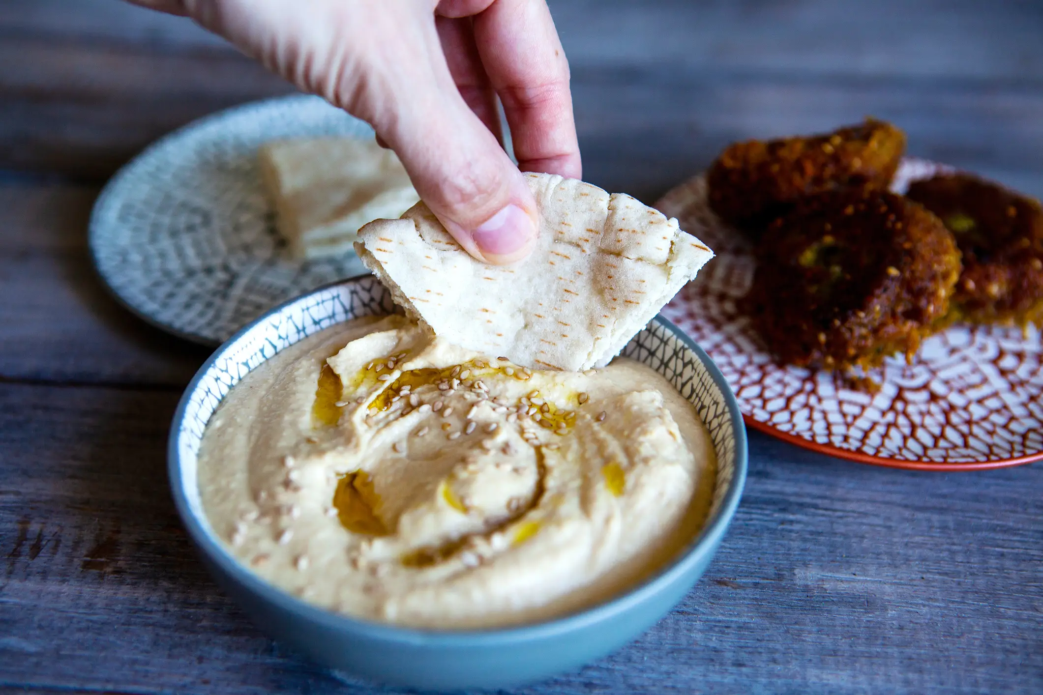 Falafel, flatbread, carrot sticks, and toast are all great houmous companions (Marina Kuttig/Getty Images)