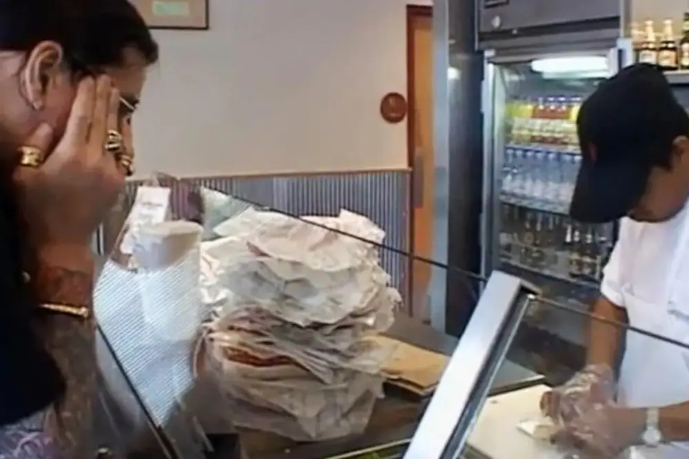 Osbourne watches, transfixed, as a Chipotle employee prepares his burrito (MTV)