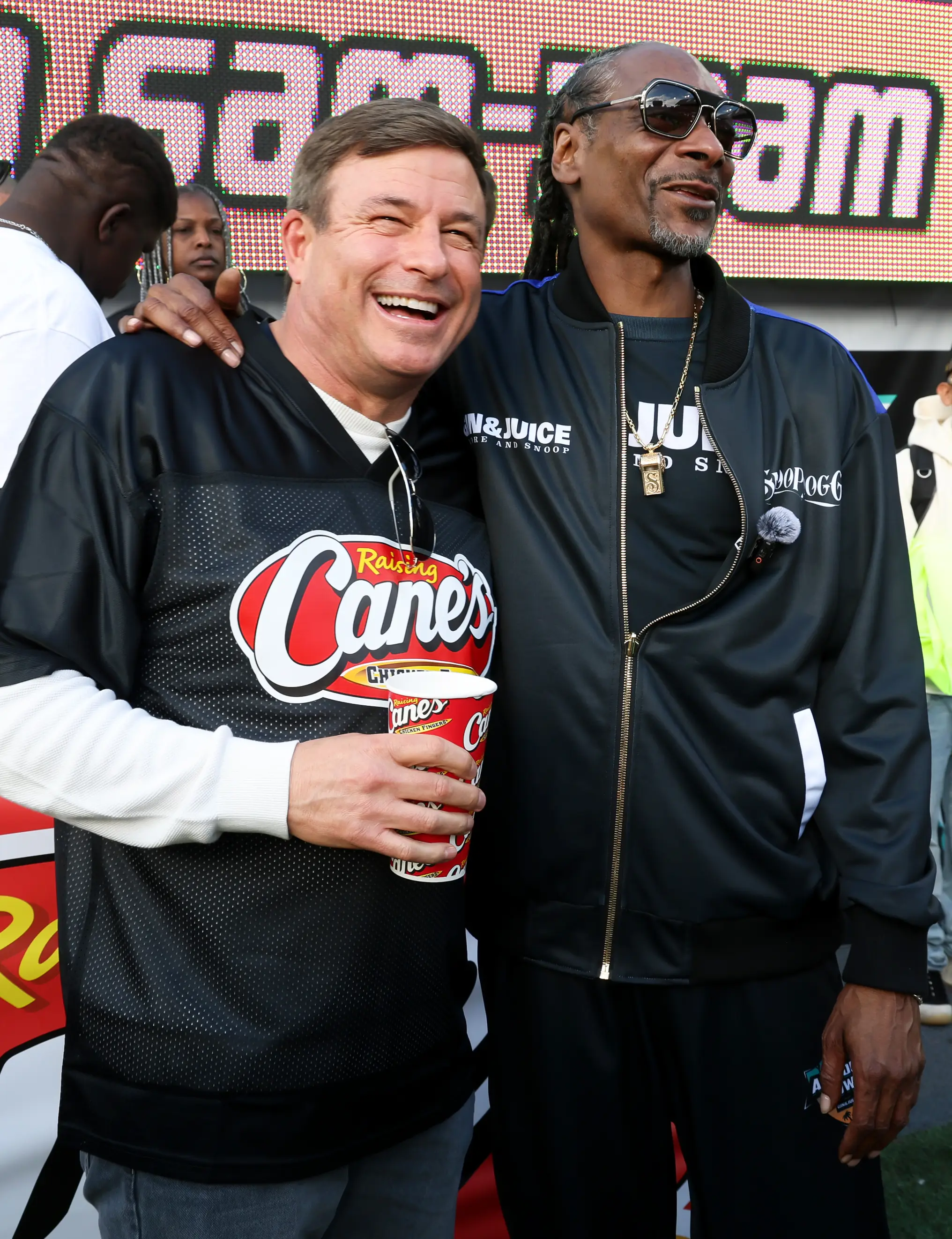 CEO Todd Graves (left) can count celebrities like Snoop Dogg (right) as fans of his brand (Phillip Faraone/Getty Images for Raising Cane's)