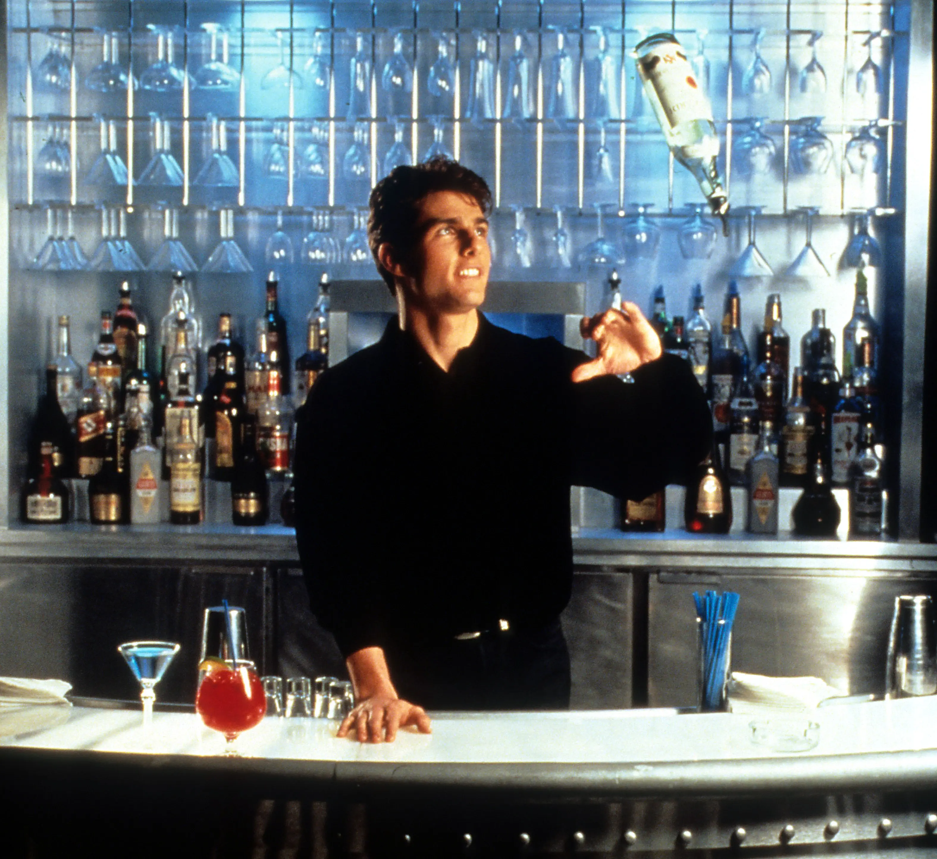 Tom Cruise learned flair bartending ahead of 1988's Cocktail (Touchstone Pictures/Getty Images)