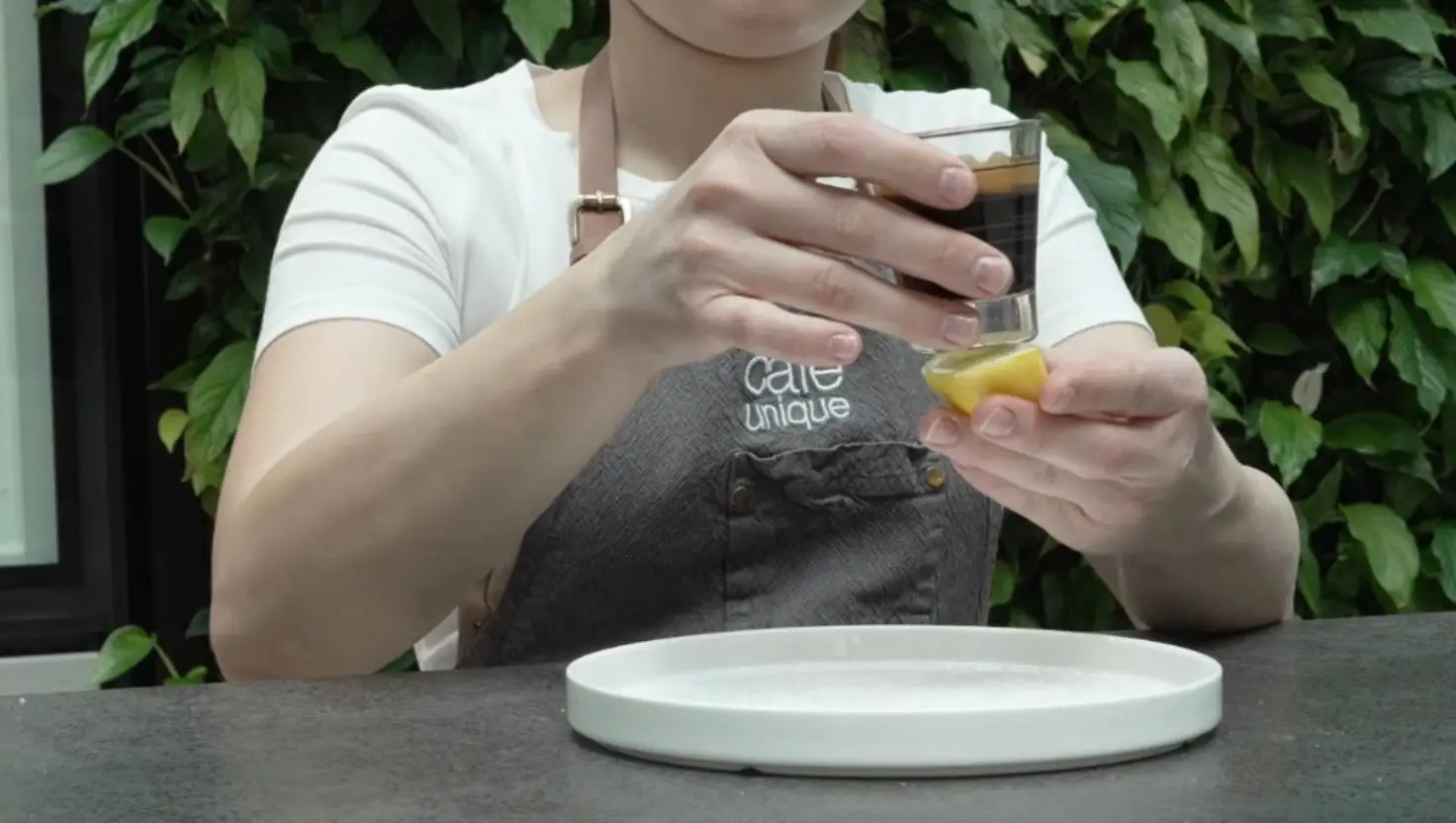 Rub a citrus fruit on the bottom of the shot glass before rolling it in salt (YouTube/Thermoplan AG)
