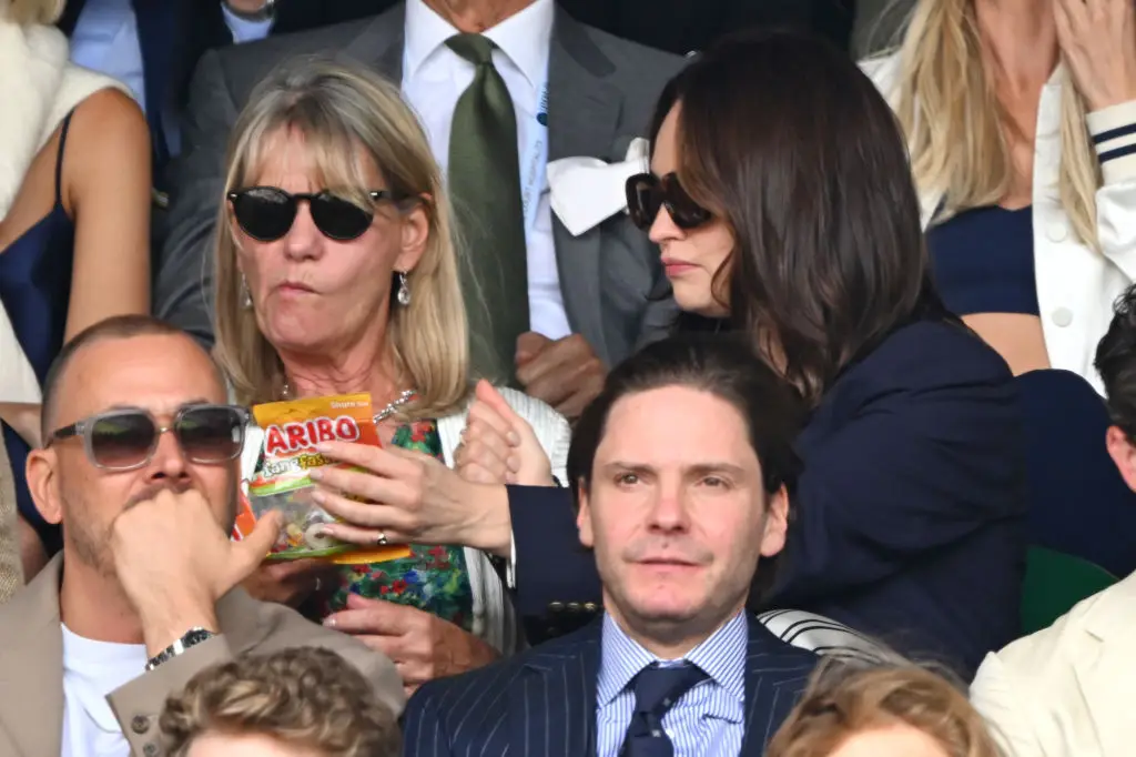 Lily James (right) fails to resist the call of the Tangfastics at Wimbledon (Karwai Tang / Contributor/Getty Images)