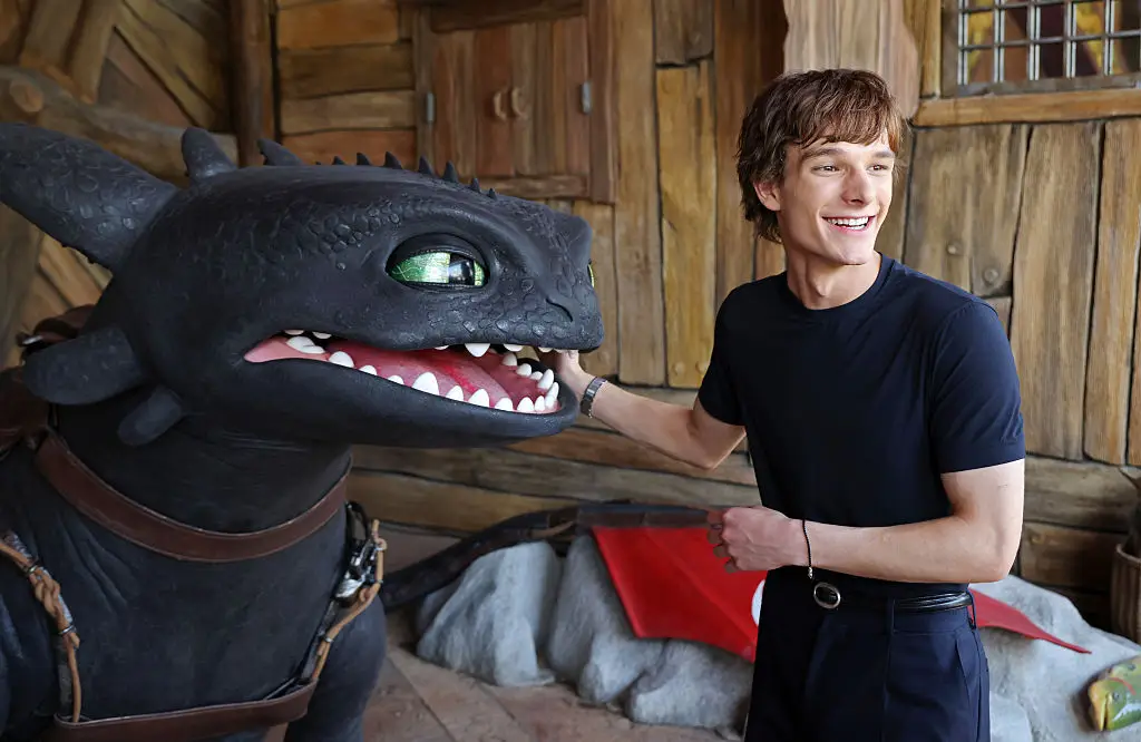 Mason Thames, star of the upcoming remake, with Toothless at Universal Epic Universe in Orlando ( Alexander Tamargo / Contributor/Getty Images)