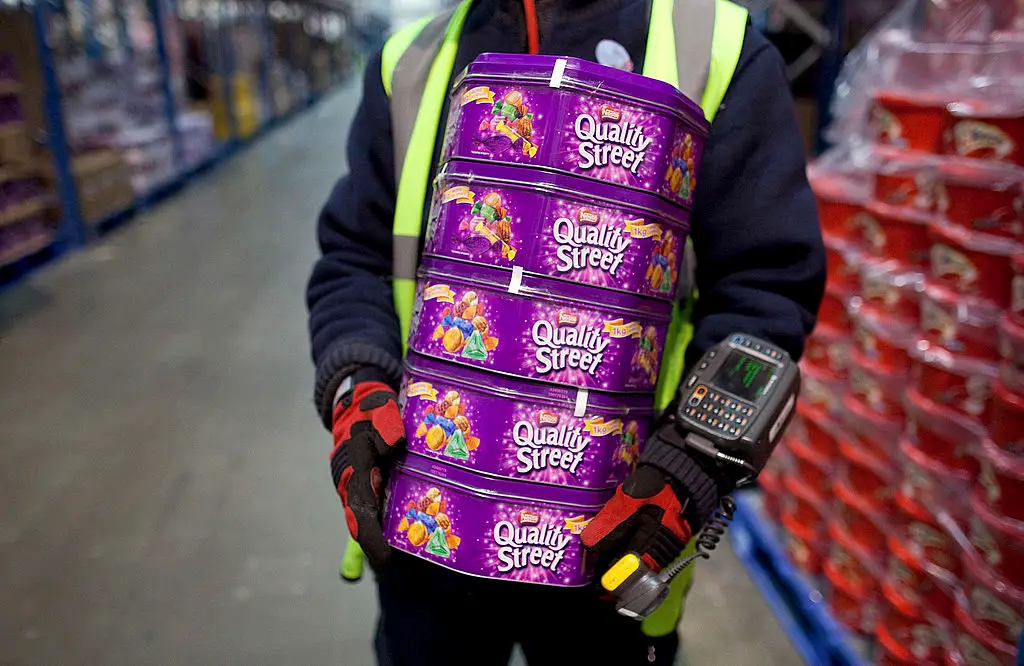 Always wear a high vis when handling multiple tins of Quality Street (Bloomberg/Getty Images)