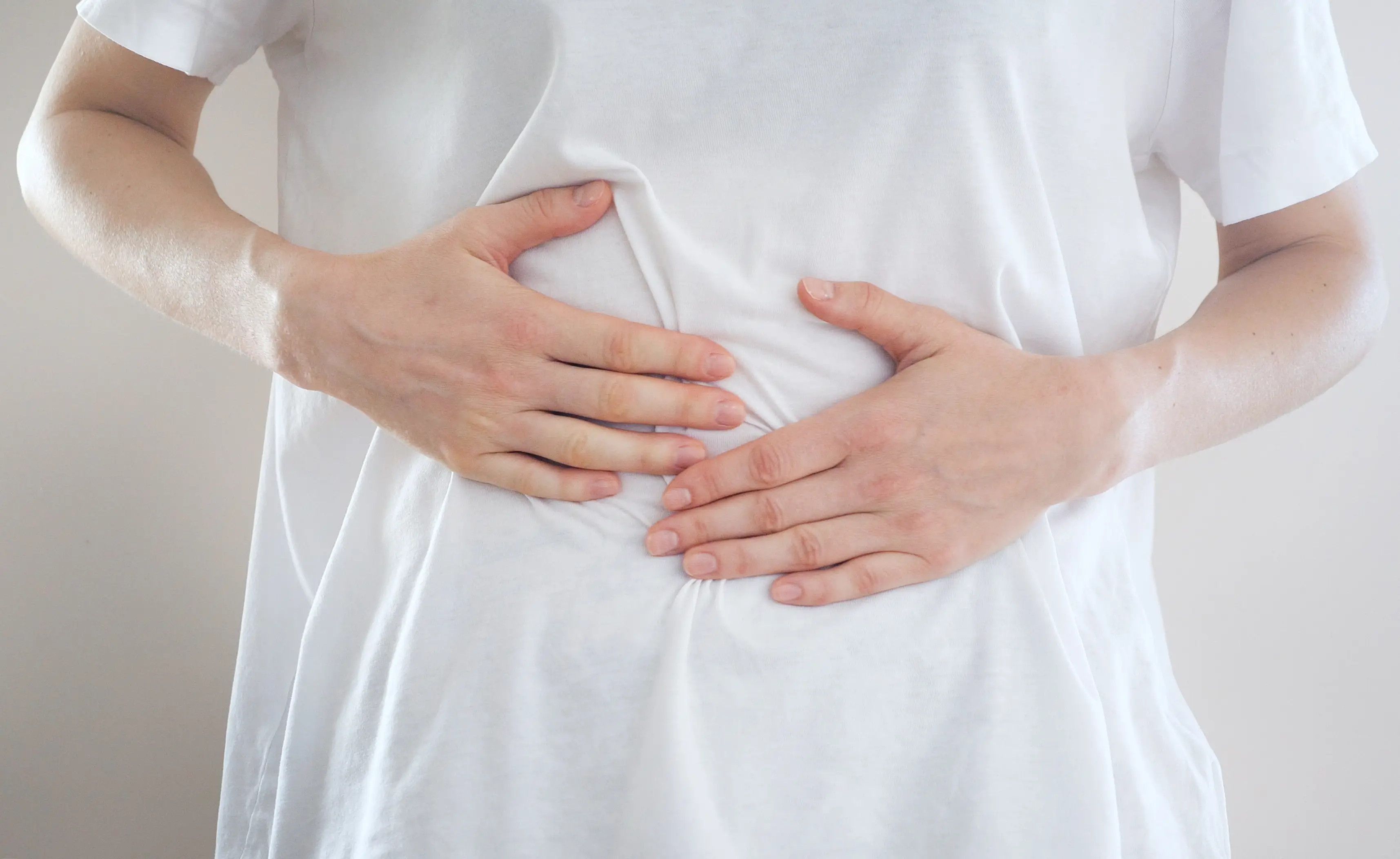 A woman with a stomach ache - DKart via Getty Images 