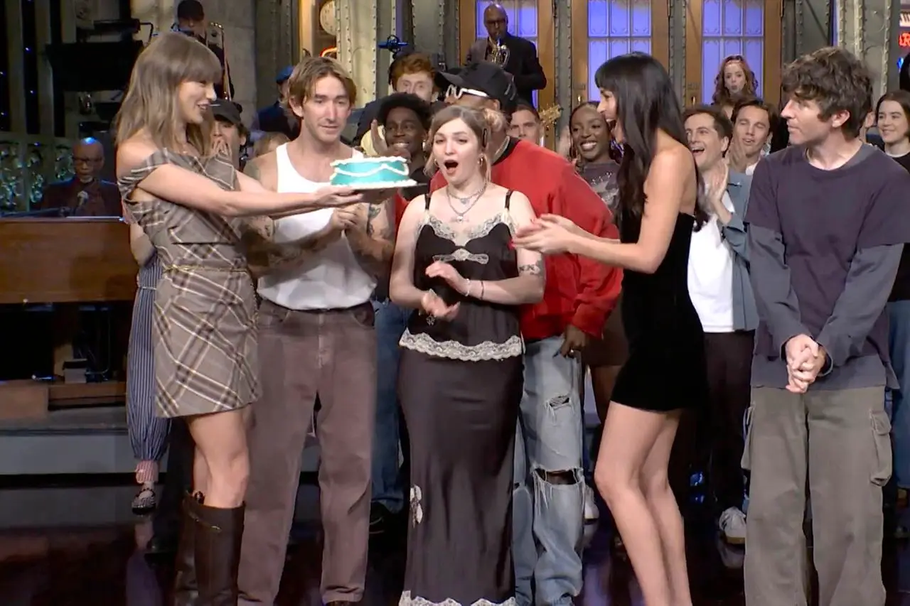 Taylor Swift presented Dakota Johnson with a birthday cake on Saturday Night Live (NBC)
