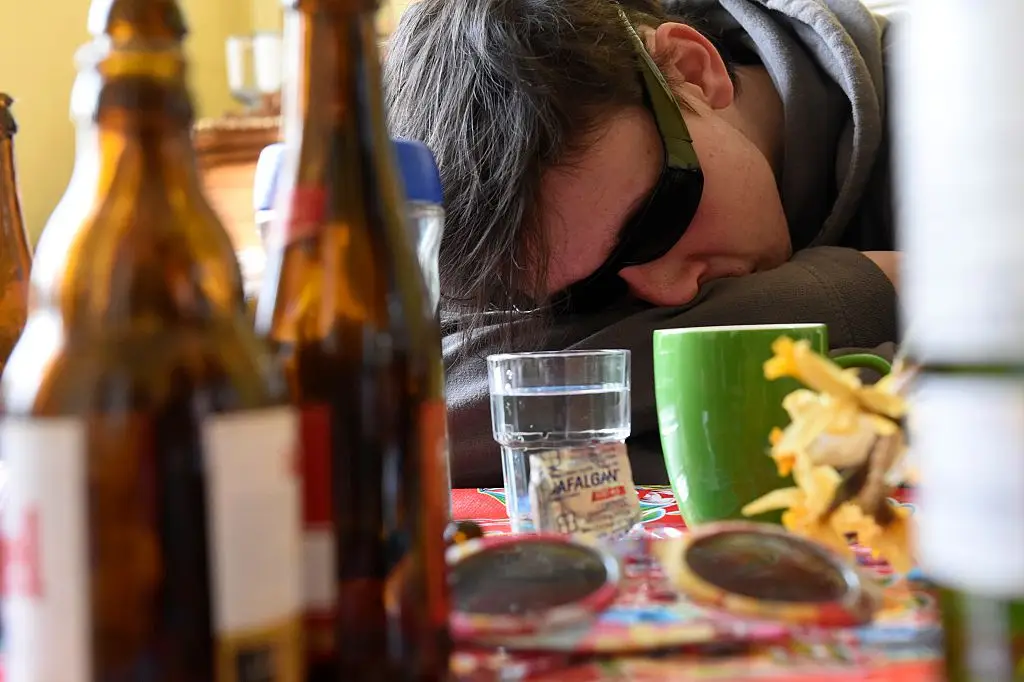 Late nights and alcohol disrupt deep sleep, worsening next-day hangover symptoms (William Van Hecke/Getty Images)