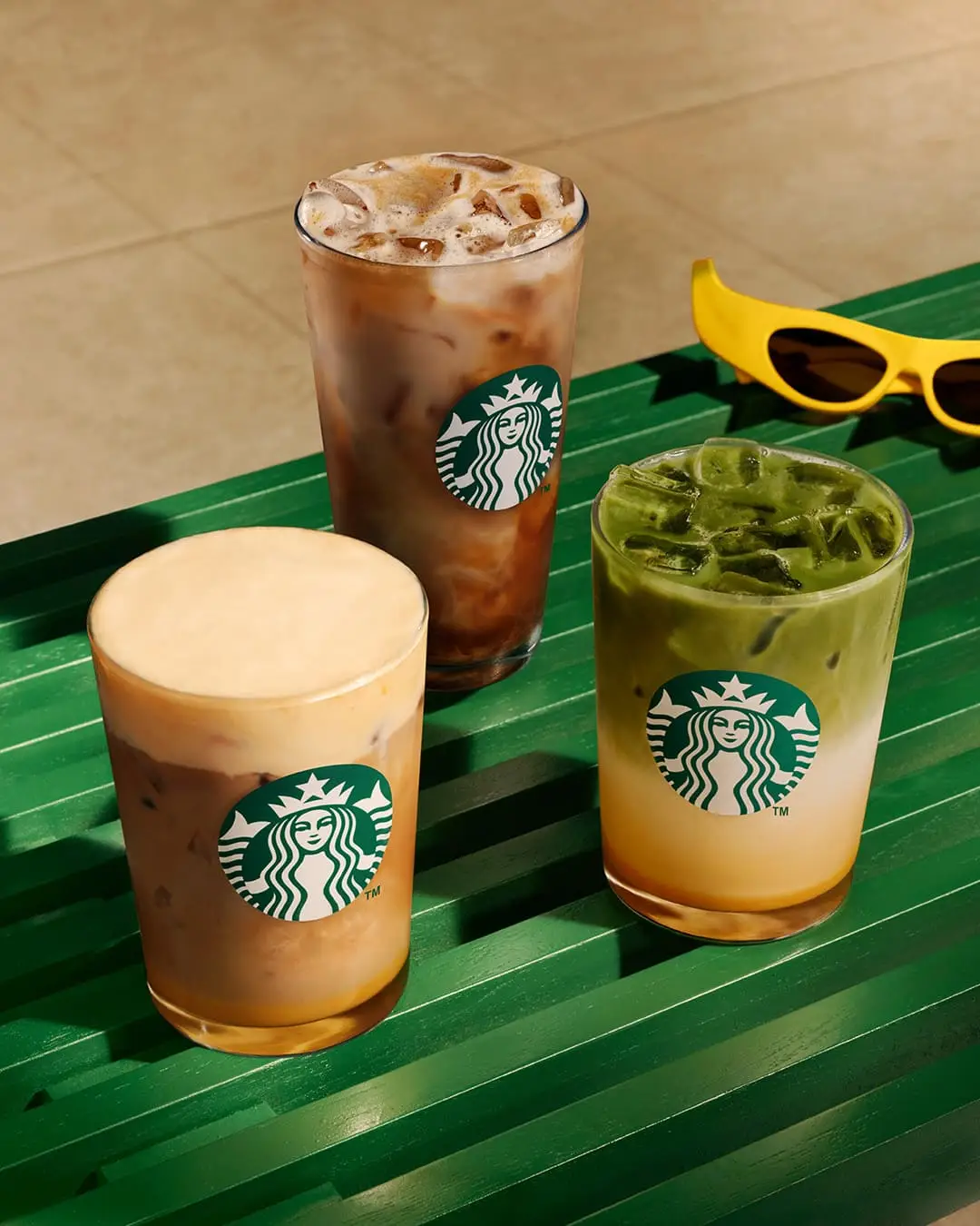 The Caramelised Banana Velvet Latte, Iced Oat Shaken Espresso, and Matcha Latte are available in-store from 2 July for non-Starbucks Rewards members (Starbucks)