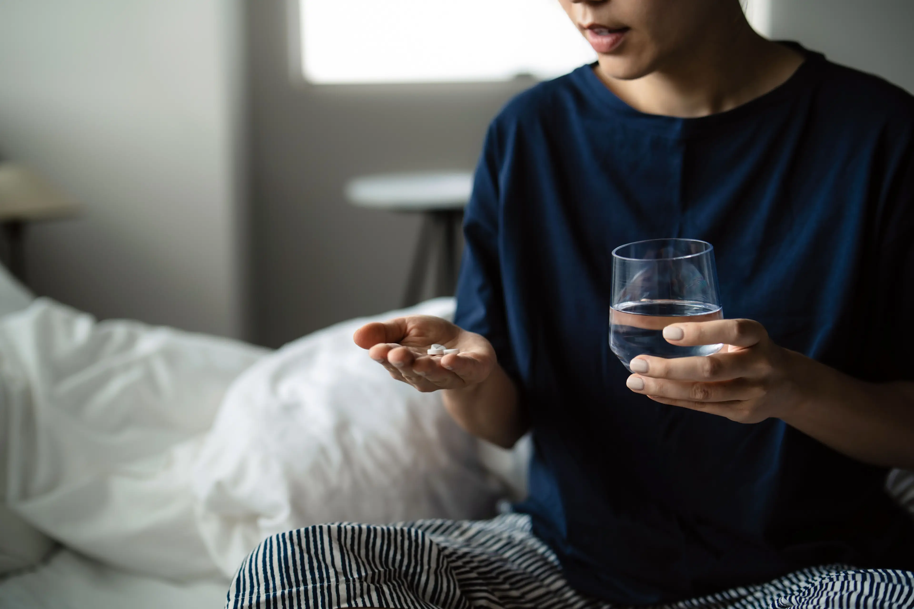 Taking your pills with cold water may not be as effective as using them alongside a wam liquid, like coffee (Getty Stock Image)
