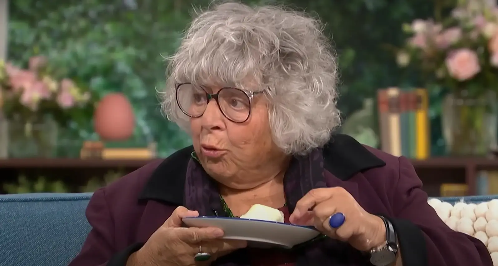 Margolyes tucked into a plate of onion and radishes as she spoke (ITV/YouTube)