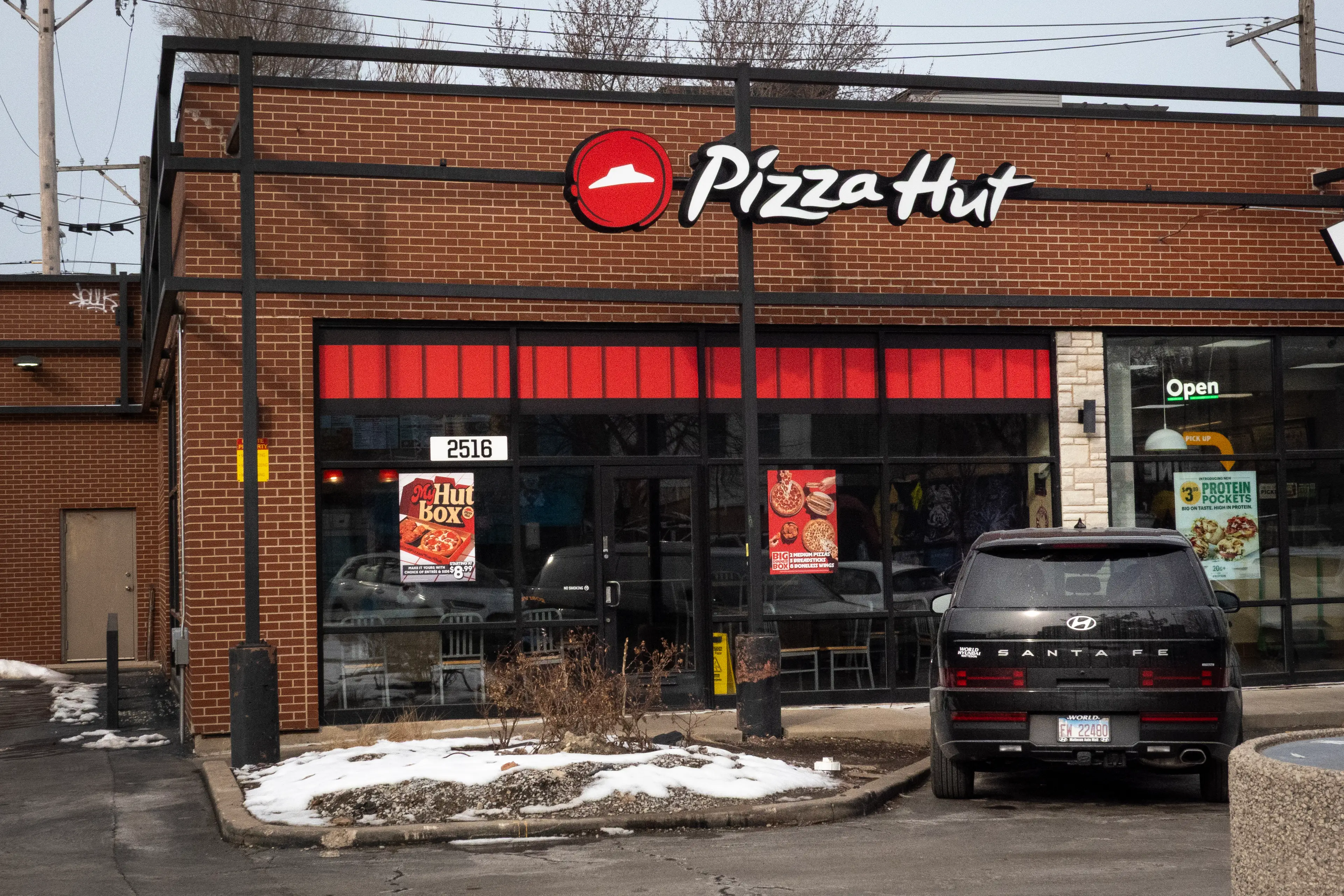 Pizza Hut is being sued by a franchise for 'failing' to step in when an AI-optimised delivery system allegedly failed (cott Olson/Getty Images)